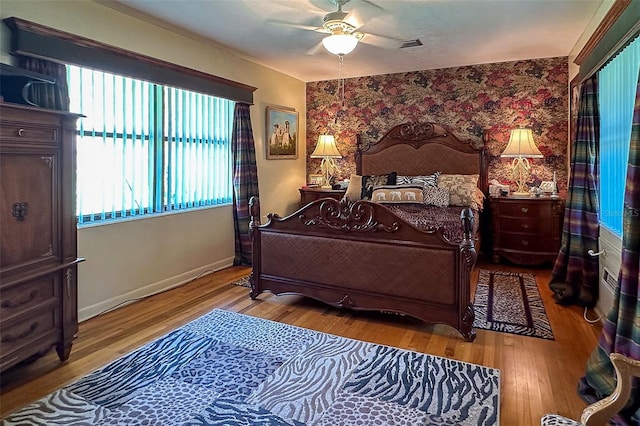 bedroom featuring ceiling fan and light wood-type flooring