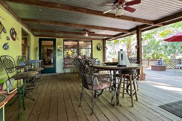 wooden deck featuring ceiling fan