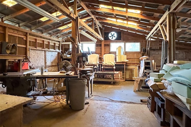 miscellaneous room featuring a workshop area and vaulted ceiling