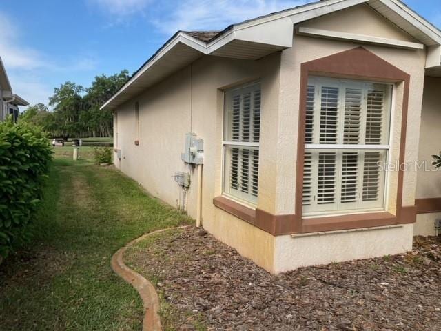 view of home's exterior featuring a yard