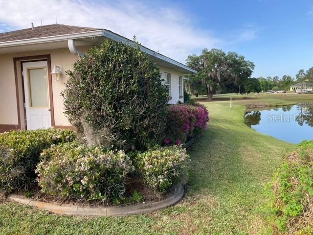 view of side of property with a yard