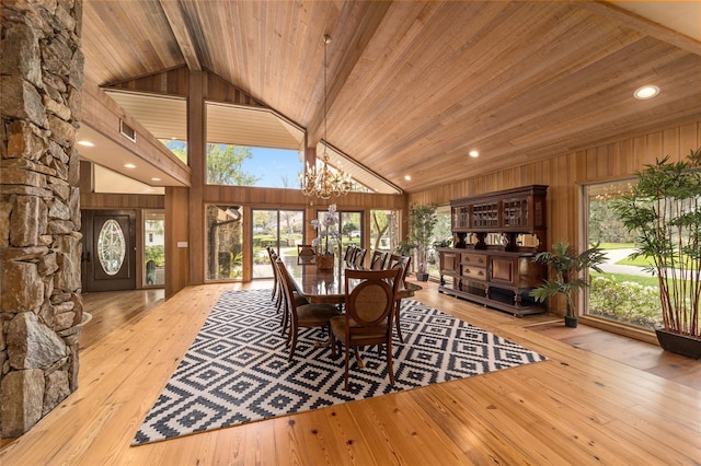 dining area featuring wood ceiling, a chandelier, light hardwood / wood-style floors, high vaulted ceiling, and beam ceiling