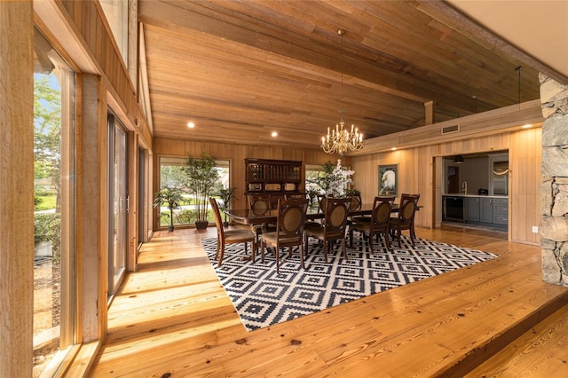 interior space featuring a chandelier, wooden ceiling, and light wood-type flooring