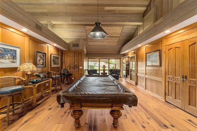 game room featuring light wood-type flooring, pool table, wood walls, and wood ceiling