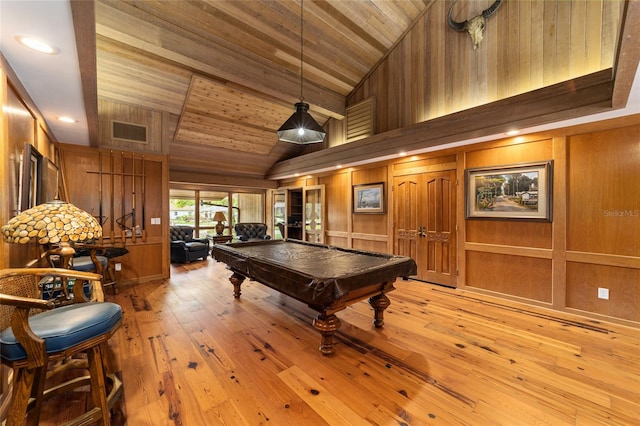 game room with wooden walls, wooden ceiling, billiards, high vaulted ceiling, and light wood-type flooring