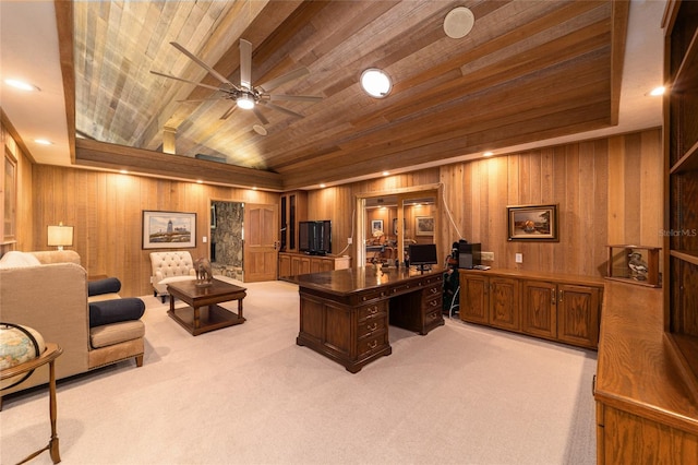 office space featuring light carpet, wood ceiling, wood walls, and ceiling fan