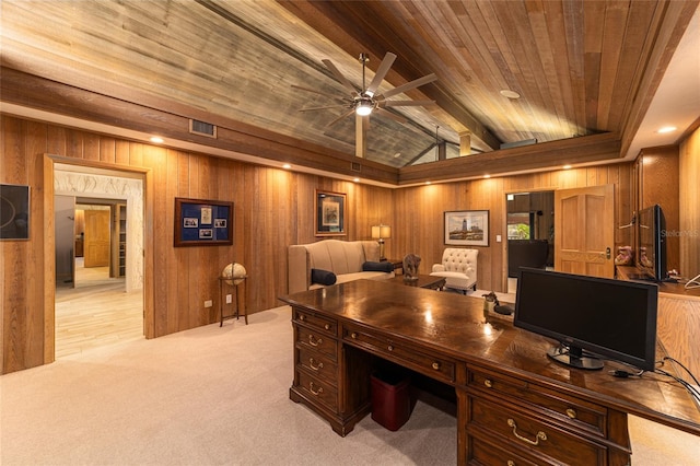 carpeted home office with wood walls, wooden ceiling, ceiling fan, and lofted ceiling with beams