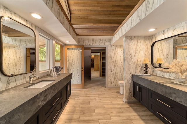 interior space with wood ceiling and sink