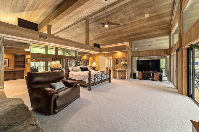 carpeted bedroom featuring wooden walls, multiple windows, and wooden ceiling