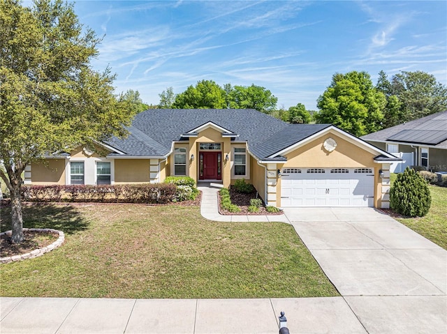 single story home featuring a front lawn, a garage, and solar panels