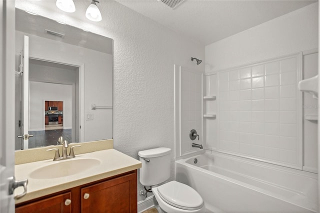 full bathroom featuring shower / washtub combination, toilet, and vanity