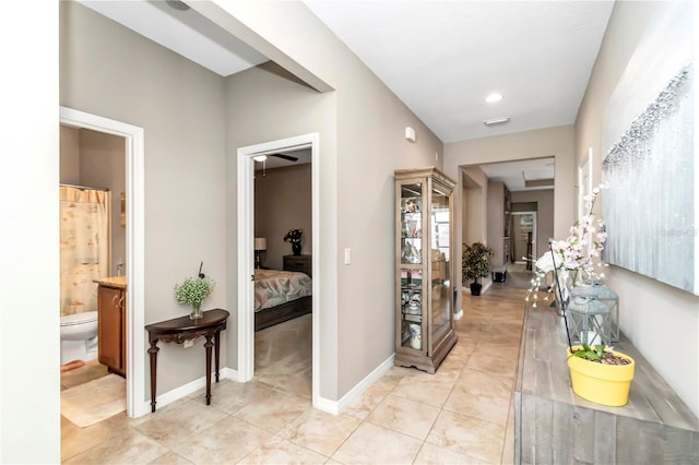 hallway with light tile flooring