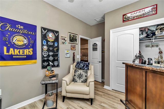 sitting room with light hardwood / wood-style flooring