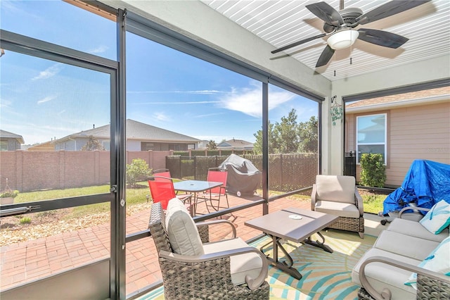 sunroom / solarium with ceiling fan