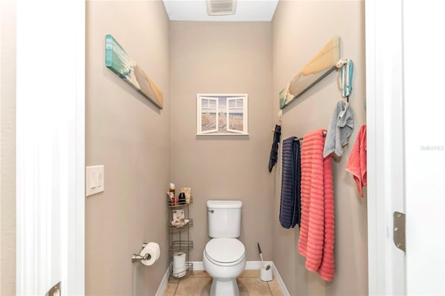 bathroom with toilet and tile flooring