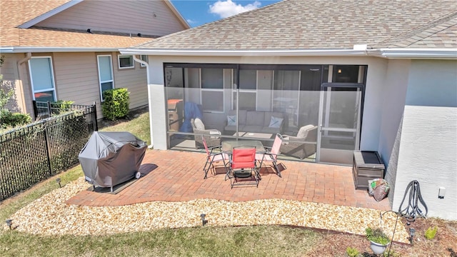 view of patio / terrace with a sunroom