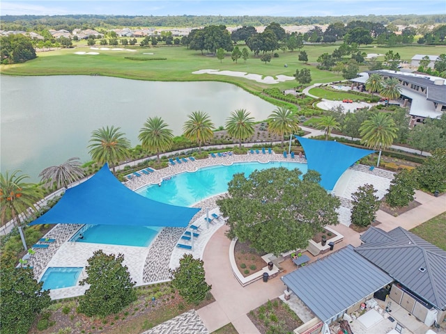 view of pool with a water view and a patio