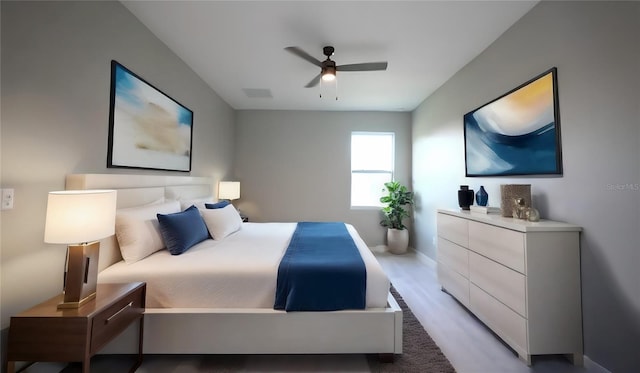 bedroom with wood-type flooring and ceiling fan