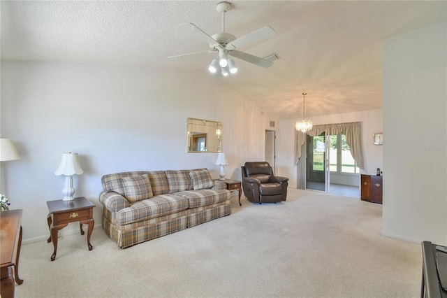 living room featuring light colored carpet, high vaulted ceiling, a textured ceiling, and ceiling fan with notable chandelier