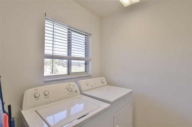 laundry area with washing machine and clothes dryer