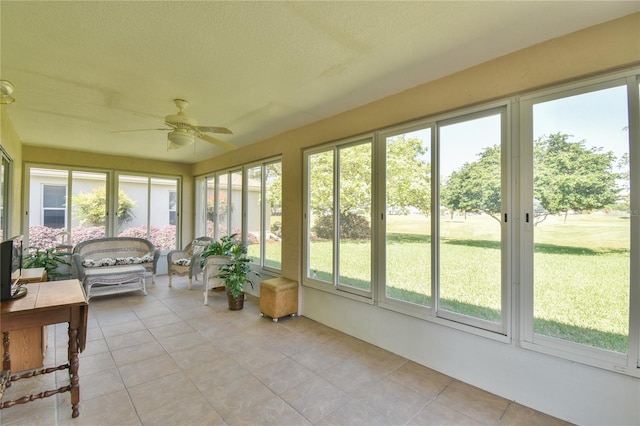 sunroom with ceiling fan and a wealth of natural light