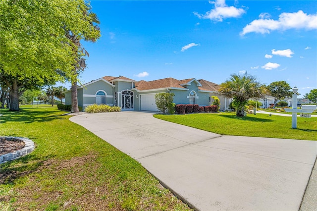 ranch-style house with a front yard and a garage