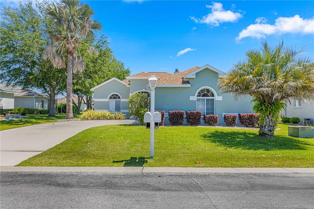 view of front of home with a front yard