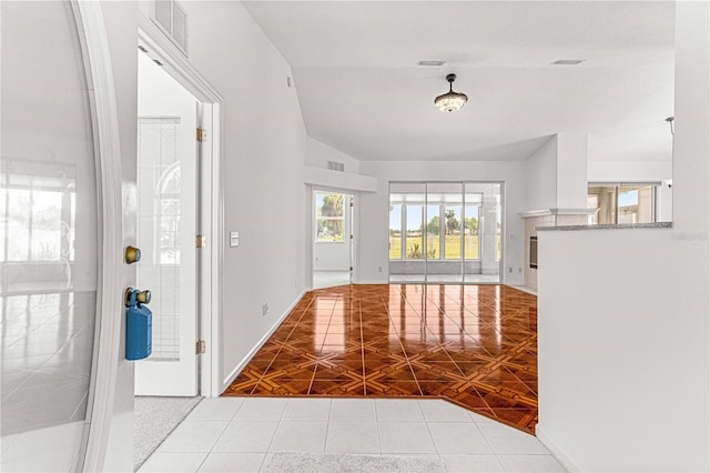 entrance foyer with light tile floors