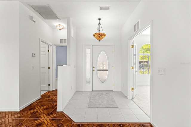 entryway with light parquet flooring