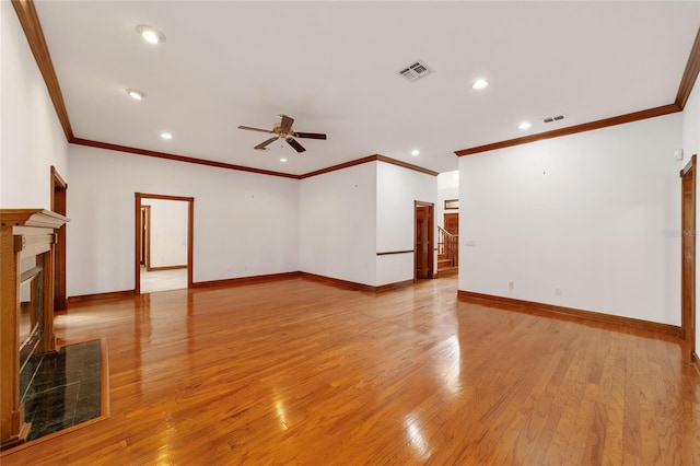 unfurnished room featuring crown molding, light hardwood / wood-style floors, and ceiling fan