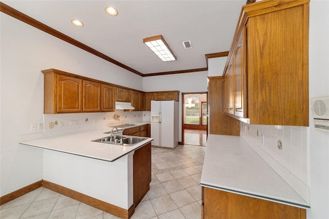 kitchen featuring white fridge with ice dispenser, stovetop, kitchen peninsula, light tile patterned floors, and ornamental molding