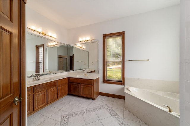 bathroom with tile patterned flooring, vanity, and a bathing tub