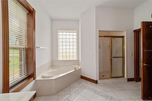 bathroom featuring independent shower and bath and tile patterned flooring