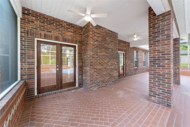 interior space with ceiling fan