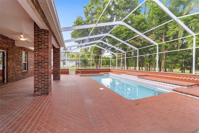 view of pool featuring a lanai, a patio, and ceiling fan