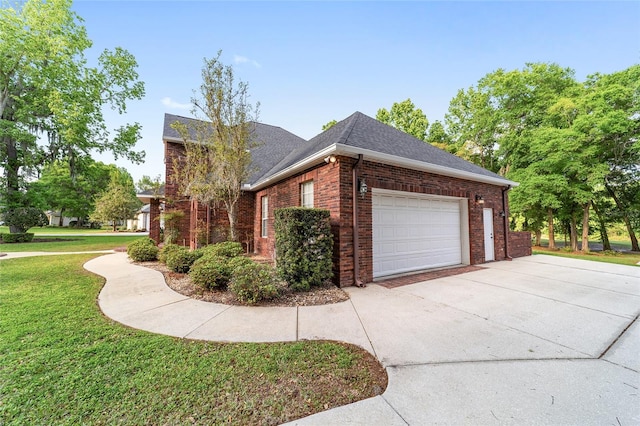 view of home's exterior featuring a yard and a garage