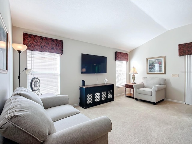 living room featuring light colored carpet and lofted ceiling