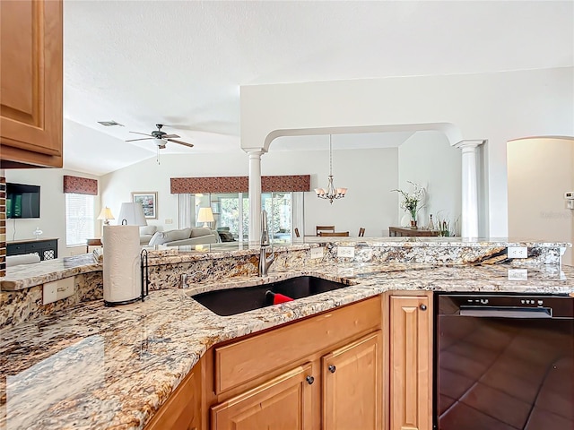 kitchen with ceiling fan with notable chandelier, a healthy amount of sunlight, sink, and decorative columns