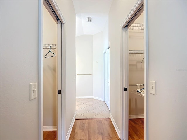 hallway with light wood-type flooring