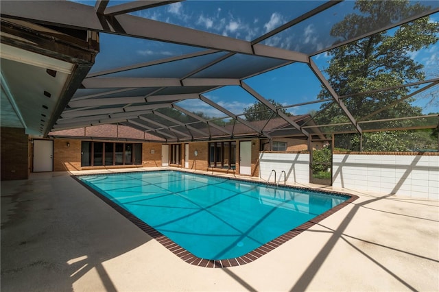 view of pool featuring a lanai and a patio