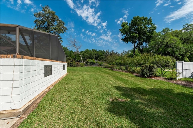 view of yard featuring a lanai