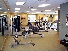 exercise room featuring a paneled ceiling