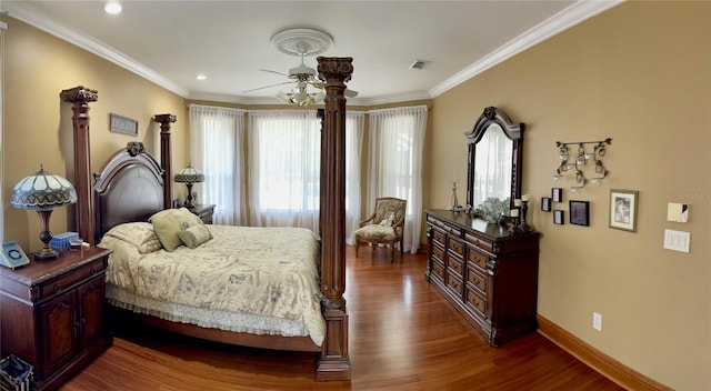 bedroom featuring ornamental molding, dark hardwood / wood-style flooring, and ceiling fan