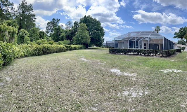 view of yard with a lanai