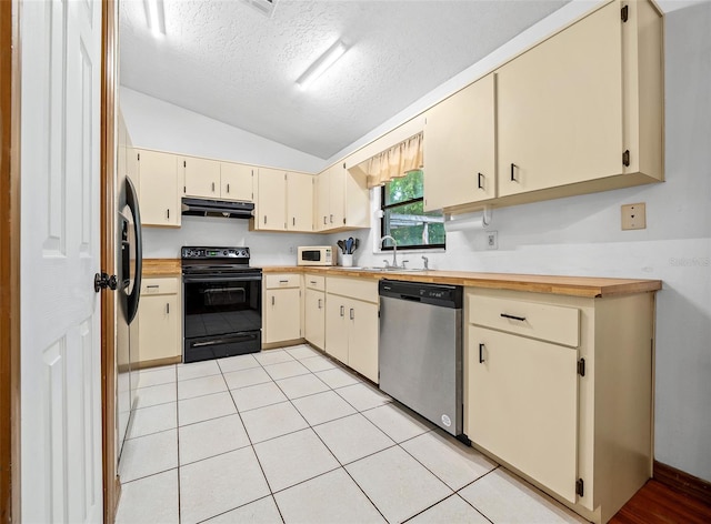 kitchen with vaulted ceiling, light tile floors, black range with electric stovetop, and stainless steel dishwasher