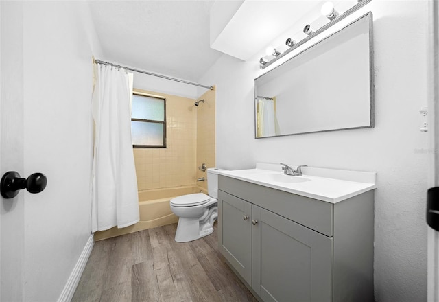 full bathroom with shower / bath combo with shower curtain, toilet, vanity, and hardwood / wood-style floors