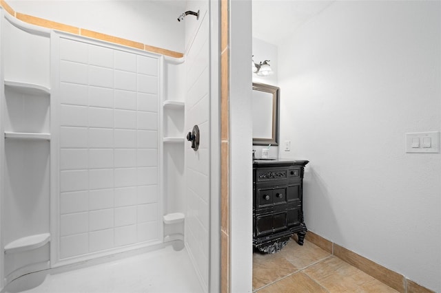 bathroom with tile flooring and vanity