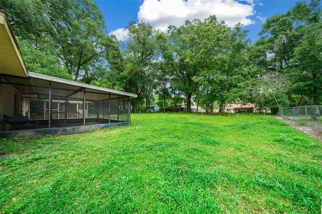 view of yard featuring a sunroom