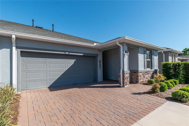 single story home featuring a garage