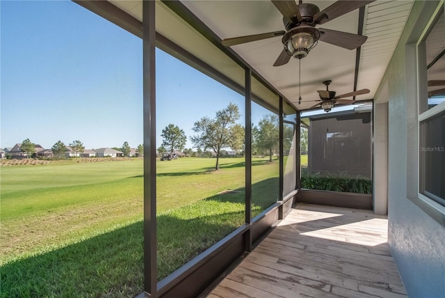 sunroom / solarium with ceiling fan